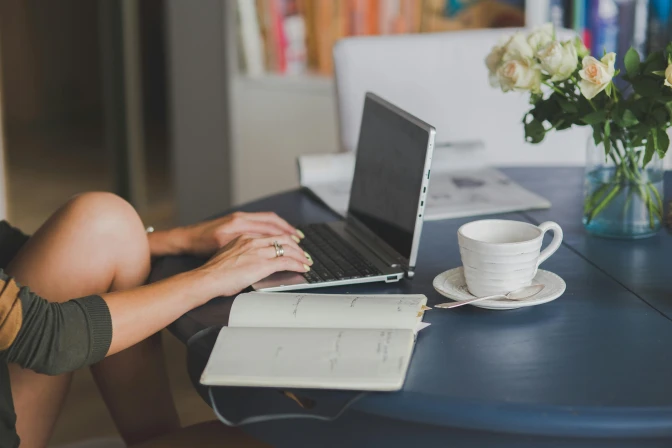 person typing at a laptop